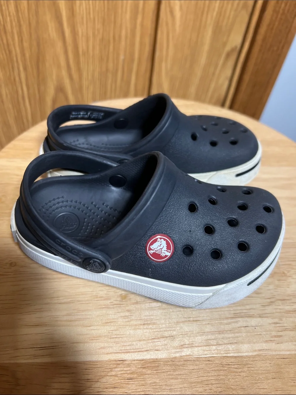 CROCS Kids Black Clogs with White Trim and Red Logo